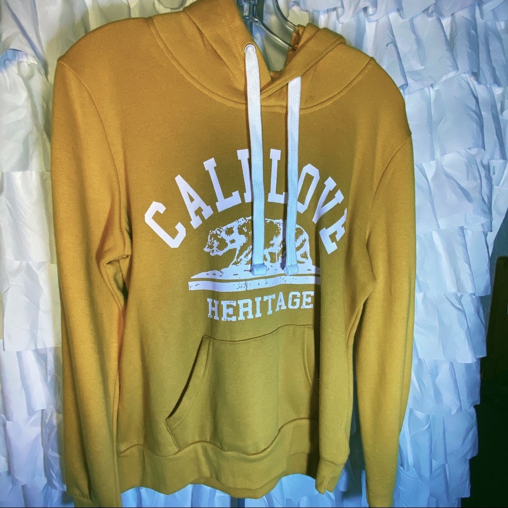 Yellow hoodie with checkered stripe sleeves